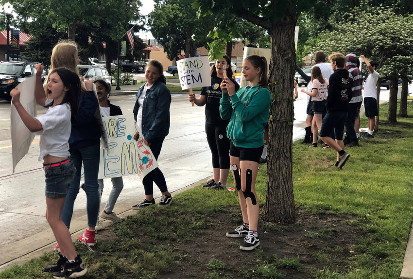 Students at STEM School Highlands Ranch plead for community support at a June 18 Douglas County School Board meeting. The board ultimately decided to table its decision on whether to rescind the school's three-year contract in favor of a one-year extension.